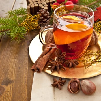 Hot drink for Christmas with cinnamon and oranges