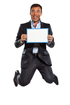 one caucasian business man jumping holding showing whiteboard in studio isolated on white background