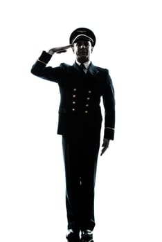 one caucasian man in airline pilot uniform saluting silhouette in studio isolated on white background
