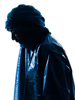 one Tuareg Portrait in silhouette studio isolated on white background