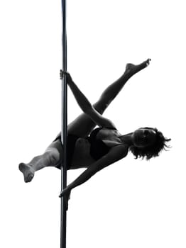 one caucasian woman pole dancer dancing in silhouette studio isolated on white background