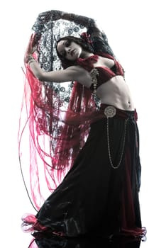 one arabic woman belly dancer dancing silhouette studio isolated on white background
