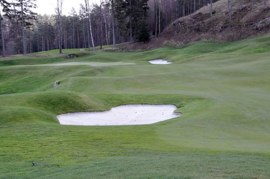 two bunkers on a golf course on an autumn day