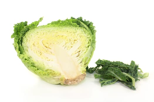 a sliced cabbage cabbage against a white background