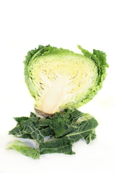 a sliced cabbage cabbage against a white background