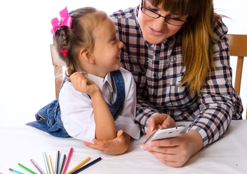 mother and daughter with mobile phone
