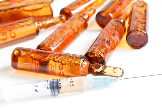Ampoules and syringe, isolated on white