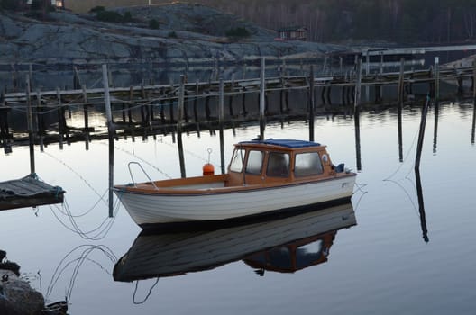 .Lonely boat in the harbor on an autumn day at dusk