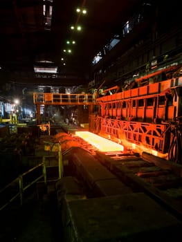hot steel on conveyor inside of plant