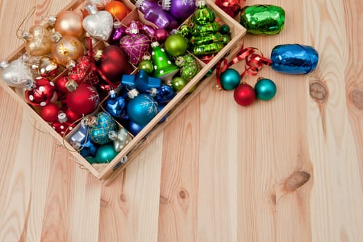 Small box with colorful Christmas tree baubles for Christmas