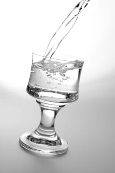 Pouring fresh water,healthy food and diet concept