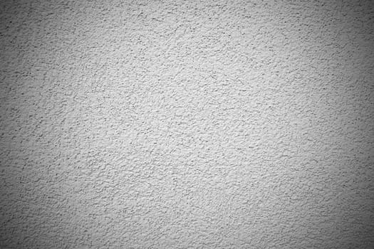 Details of a outdoors roughcast of a wall.
