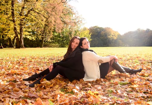 Girlfriends sitting in the park