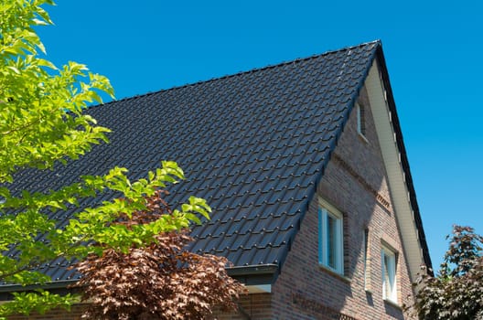 brand new roof top with dark tiles