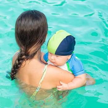 Baby and mother in a sea