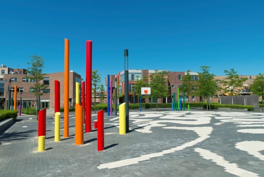 modern school yard with artistic colored poles