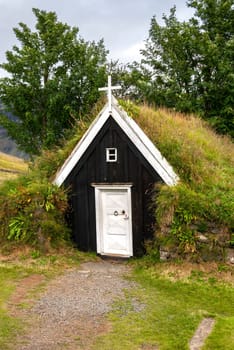 small church with a roof covered with grass in Iceland