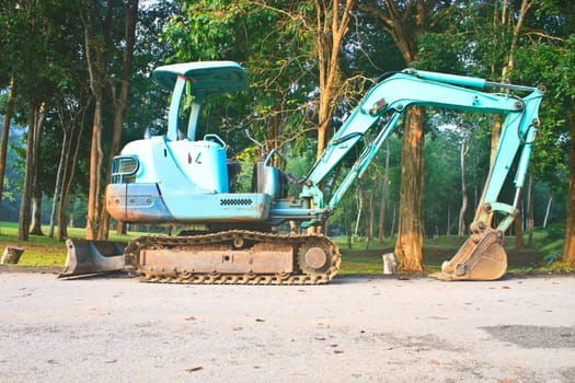 Back Hoe construction machinery equipment standing in construction site