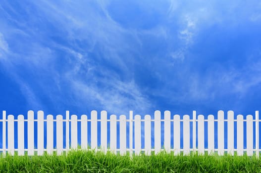 white fence and blue sky