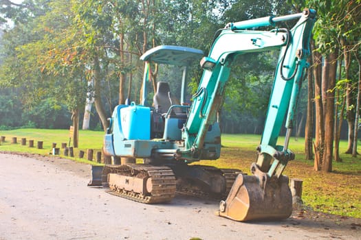 Back Hoe construction machinery equipment standing in construction site