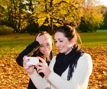 Girlfriends with smartphones