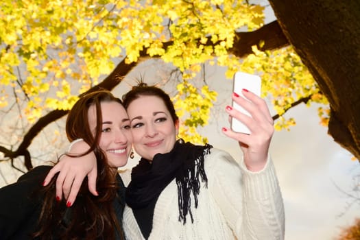 Girlfriends with smartphones