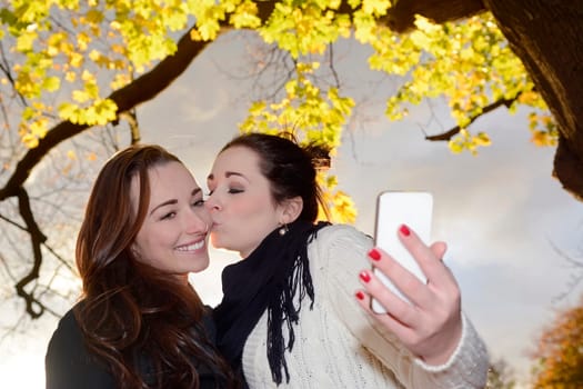 Girlfriends with smartphones