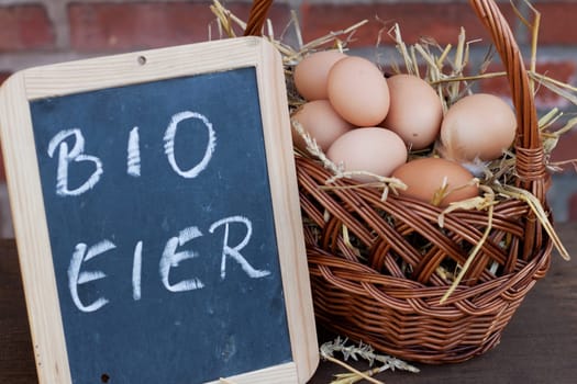 Organic eggs in a wicker basket