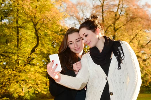 Girlfriends with smartphones