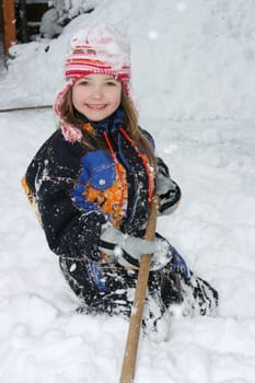 a blonde girl having fun in the snow