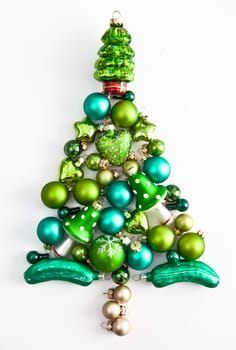 Christmas tree made of green Christmas tree baubles on white