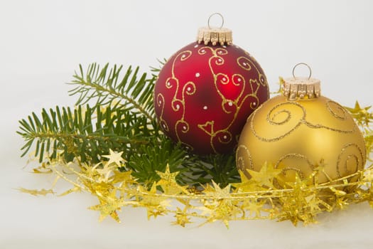 Red and Golden Christmas Balls on the white background.