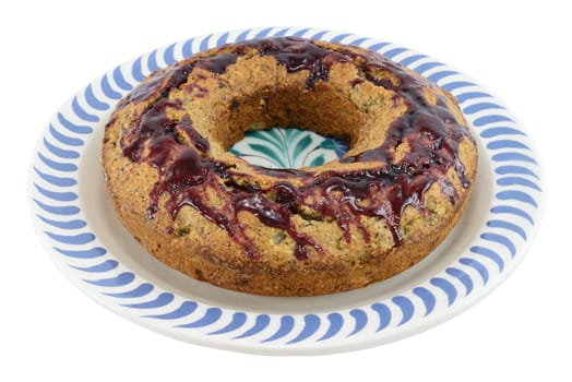 Homemade pear - dark chocolate - peanut cake, baked in a ring form, isolated on white.