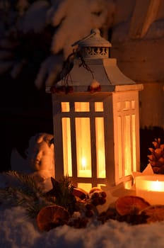 Lantern in the snow contemplative Christmas candlelight