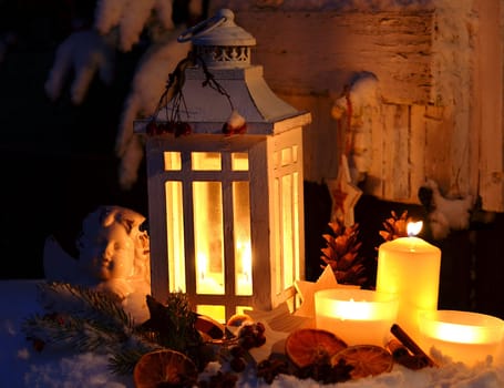 Lantern in the snow contemplative Christmas candlelight