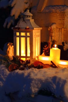 Lantern in the snow contemplative Christmas candlelight