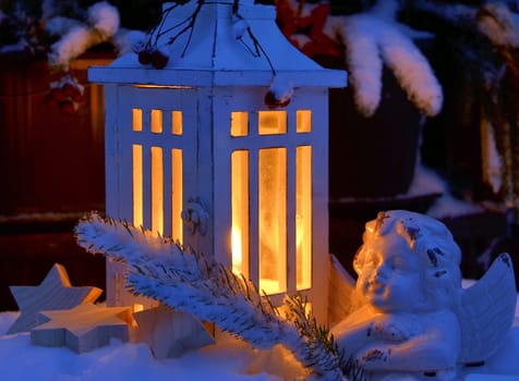 Lantern in the snow contemplative Christmas candlelight