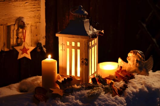 Lantern in the snow contemplative Christmas candlelight