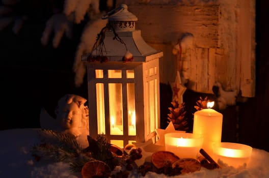 Lantern in the snow contemplative Christmas candlelight