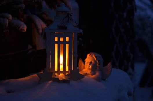 Lantern in the snow contemplative Christmas candlelight