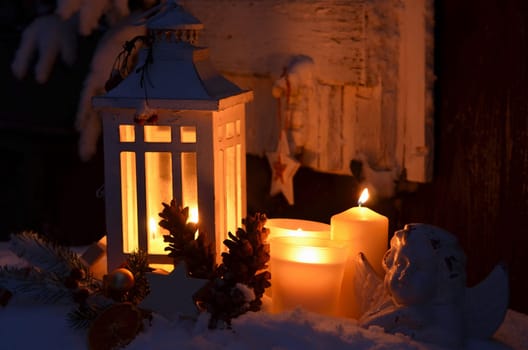 Lantern in the snow contemplative Christmas candlelight