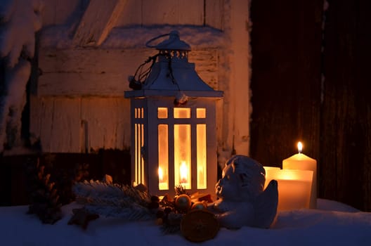 Lantern in the snow contemplative Christmas candlelight
