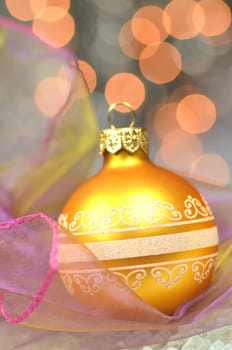 christmas decoration, golden Christmas ball against bokeh background