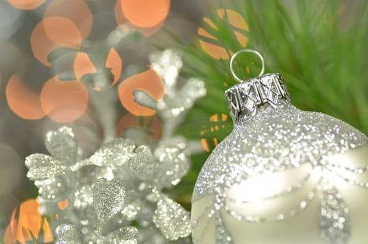 christmas decoration, silver Christmas ball against bokeh background