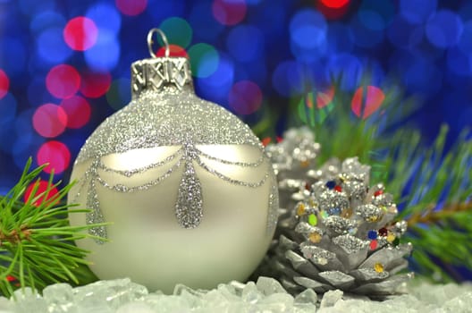 christmas decoration, silver Christmas ball against bokeh background