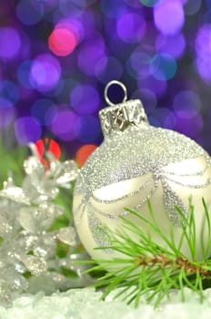 christmas decoration, silver Christmas ball against bokeh background