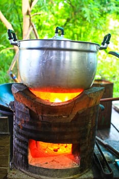 Rice cooker, boiling in the aluminum pot on Stove
