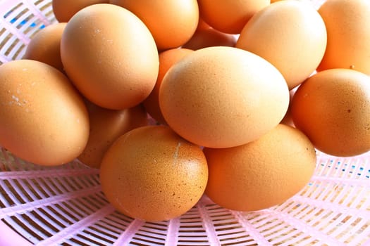 Place the eggs in a basket on the table