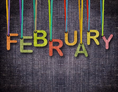 February letters hanging strings with blue sackcloth background.