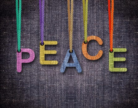 Peace Letters hanging strings with blue sackcloth background.